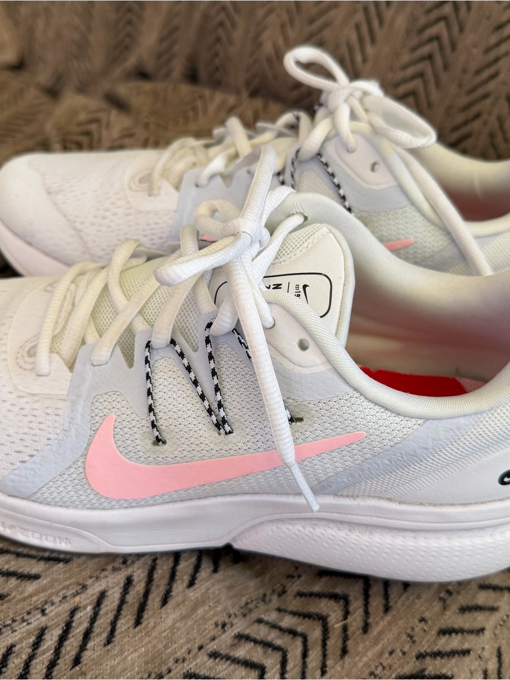 Nike Women's White Athletic Shoes with Pink Swoosh